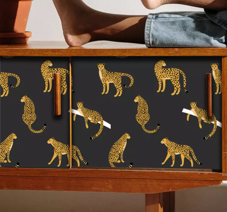 Klebefolie Möbel Leoparden auf dunklem hintergrundmuster - TenStickers