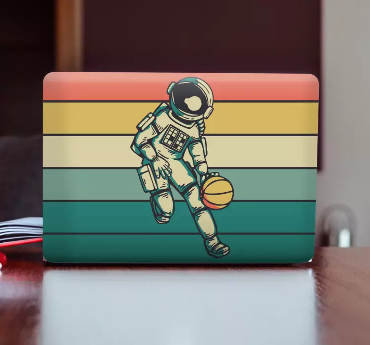 Laptop Aufkleber astronaut spielt ball - TenStickers